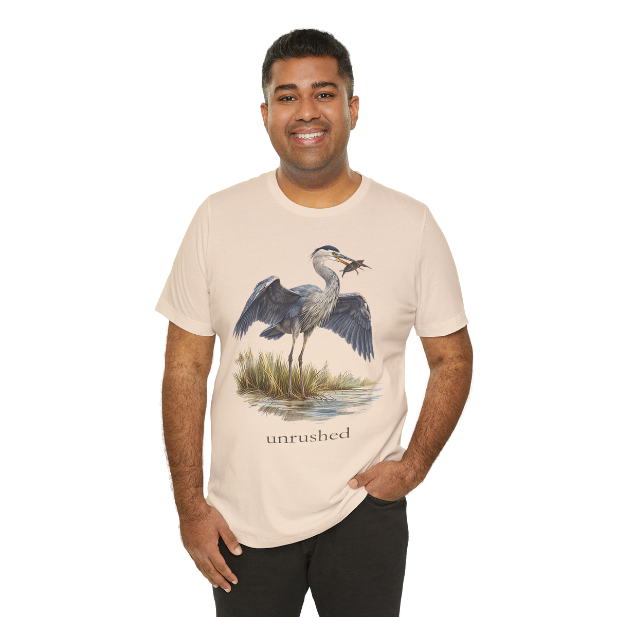 Man wearing the cream Val Tee with the great blue heron print