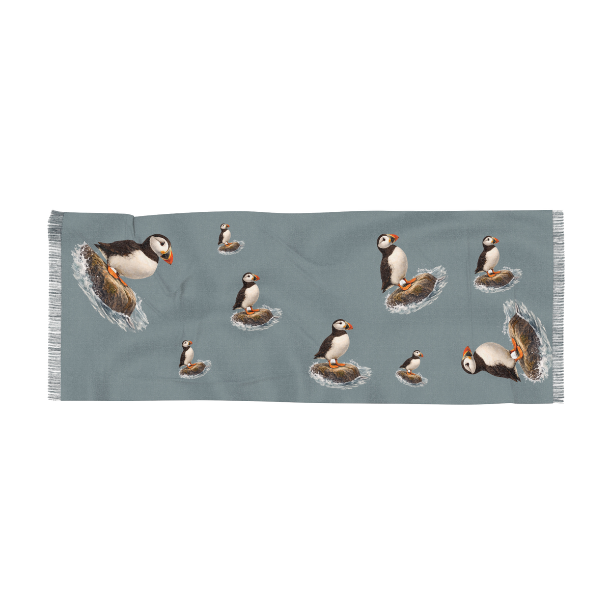 Bram Coastal Stillness wrap laid flat, slate blue with puffins on rocks and sea spray